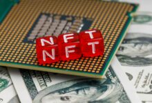 a close up of a small red block on top of a pile of money