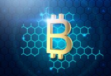 a golden bitcoin on a blue hexagonal background