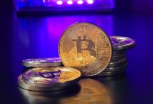 a pile of bitcoins sitting on top of a table