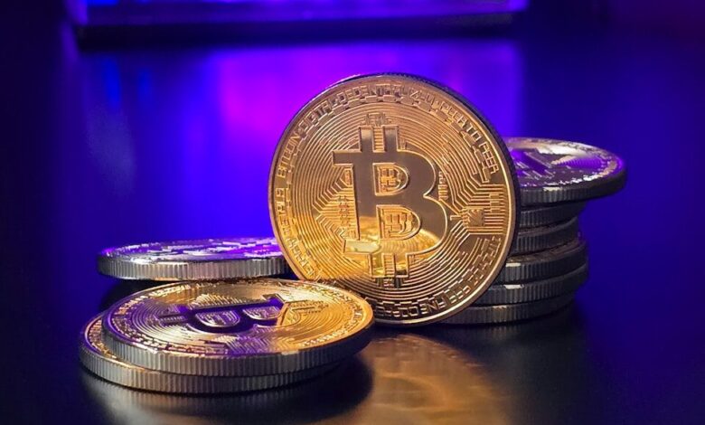 a pile of bitcoins sitting on top of a table